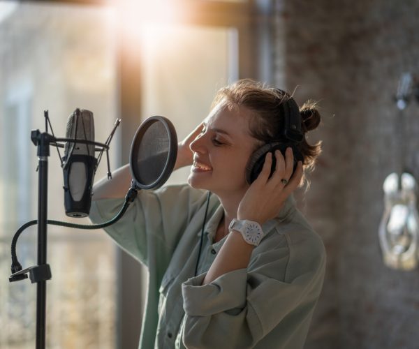 Young,Beautiful,Woman,Recording,Song,Singing,Into,Microphone,,Vocal,Lessons