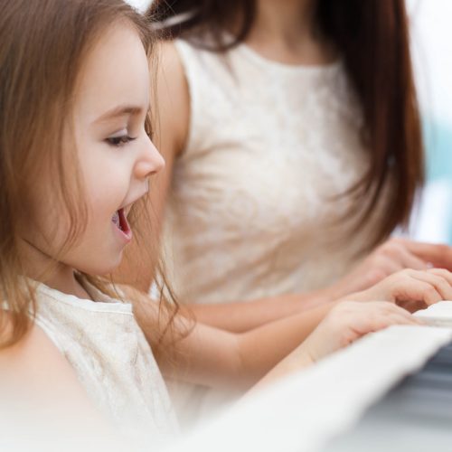 Little,Girl,Sings,While,She,And,Another,Woman,Play,Piano